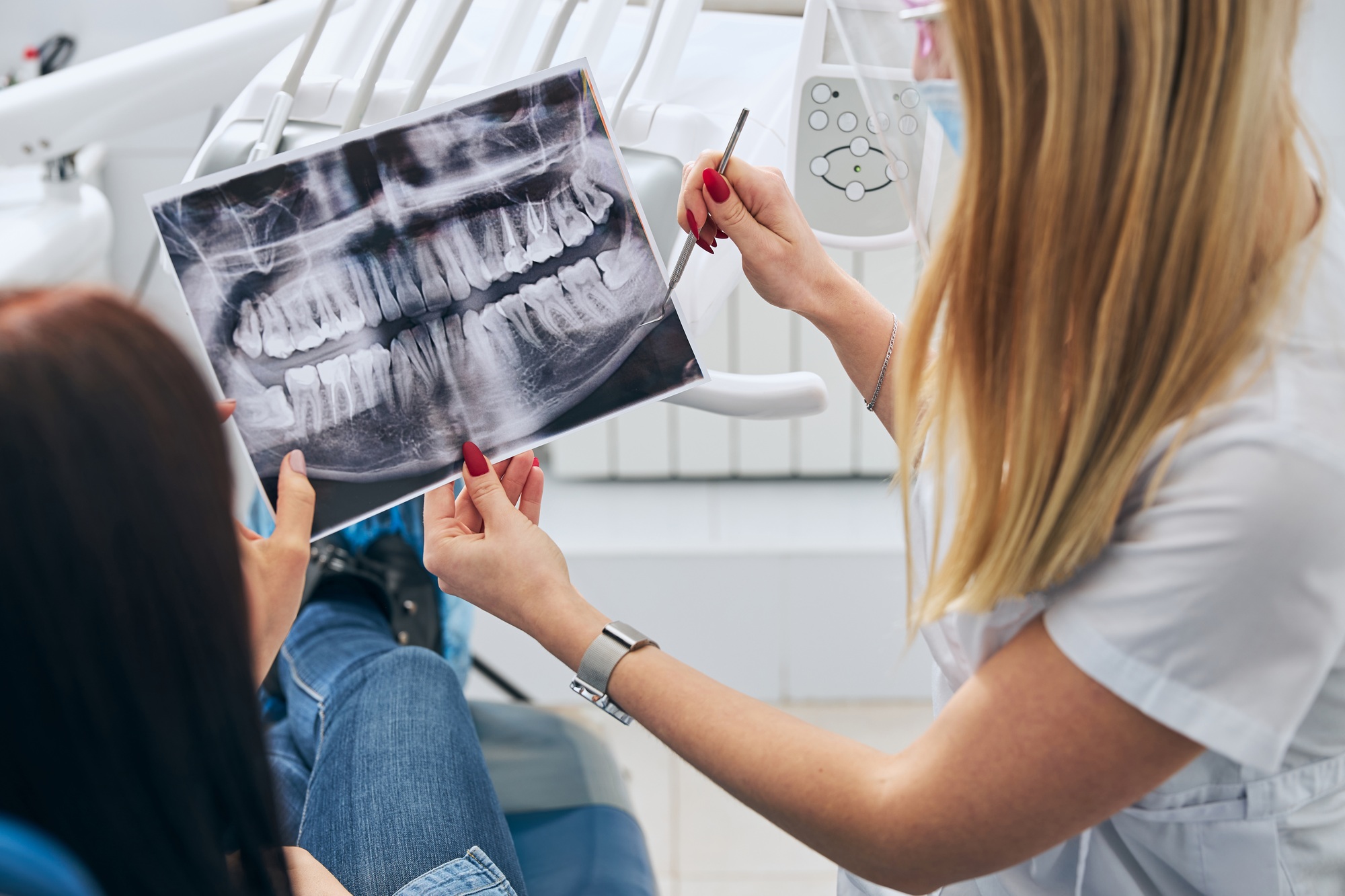A Love To Smile dentist consulting a patient