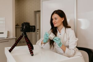 Woman dentist working on teeth implant