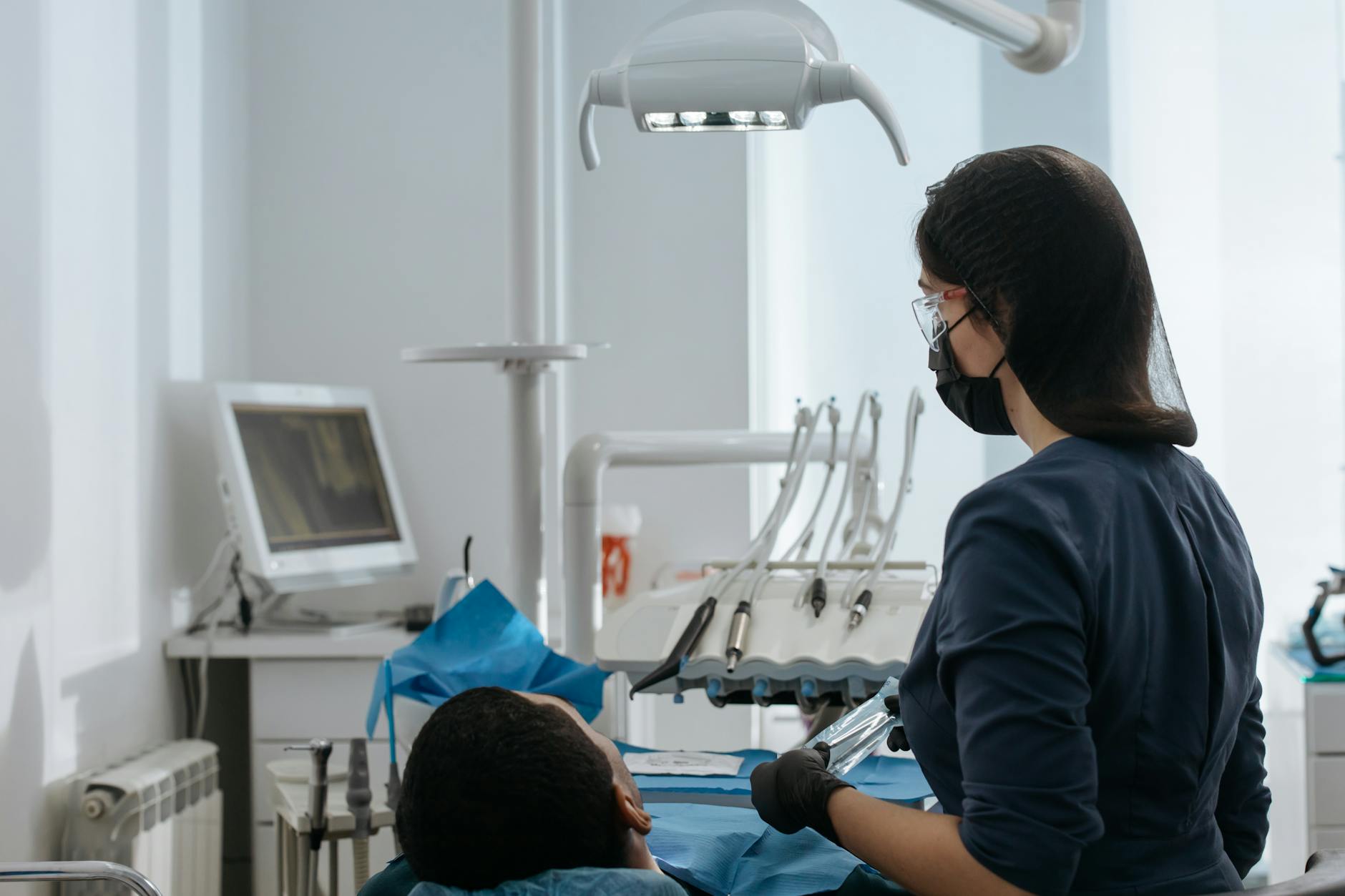 calm patient receiving gentle dental care with nitrous oxide mask