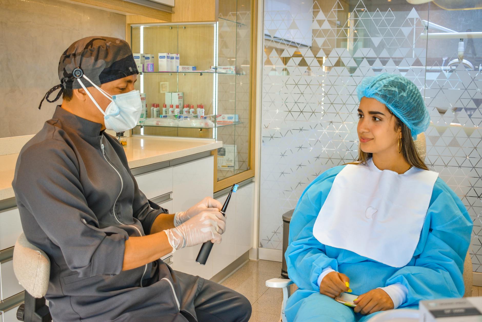 happy patient and dentist having friendly consultation discussion