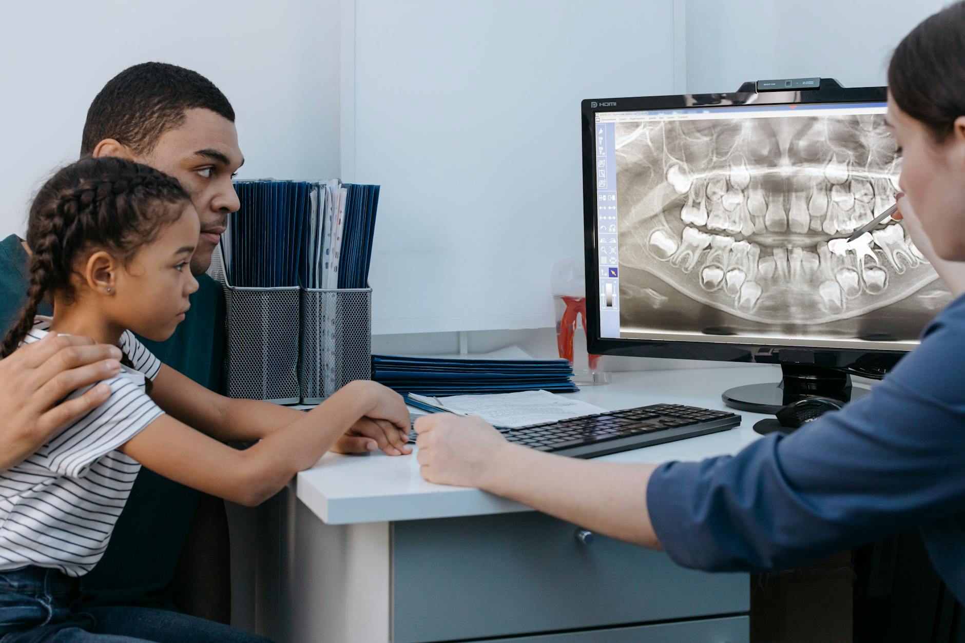 pediatric orthodontic consultation with dentist and child