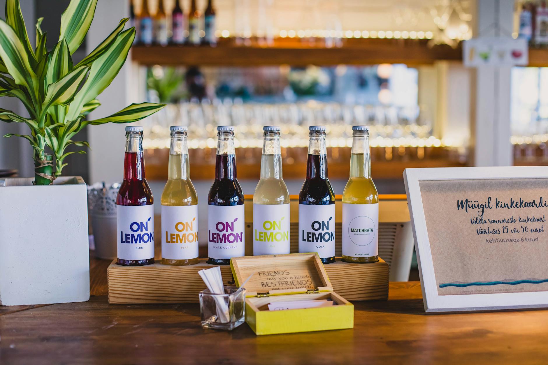 variety of sparkling water bottles and citrus fruits on counter