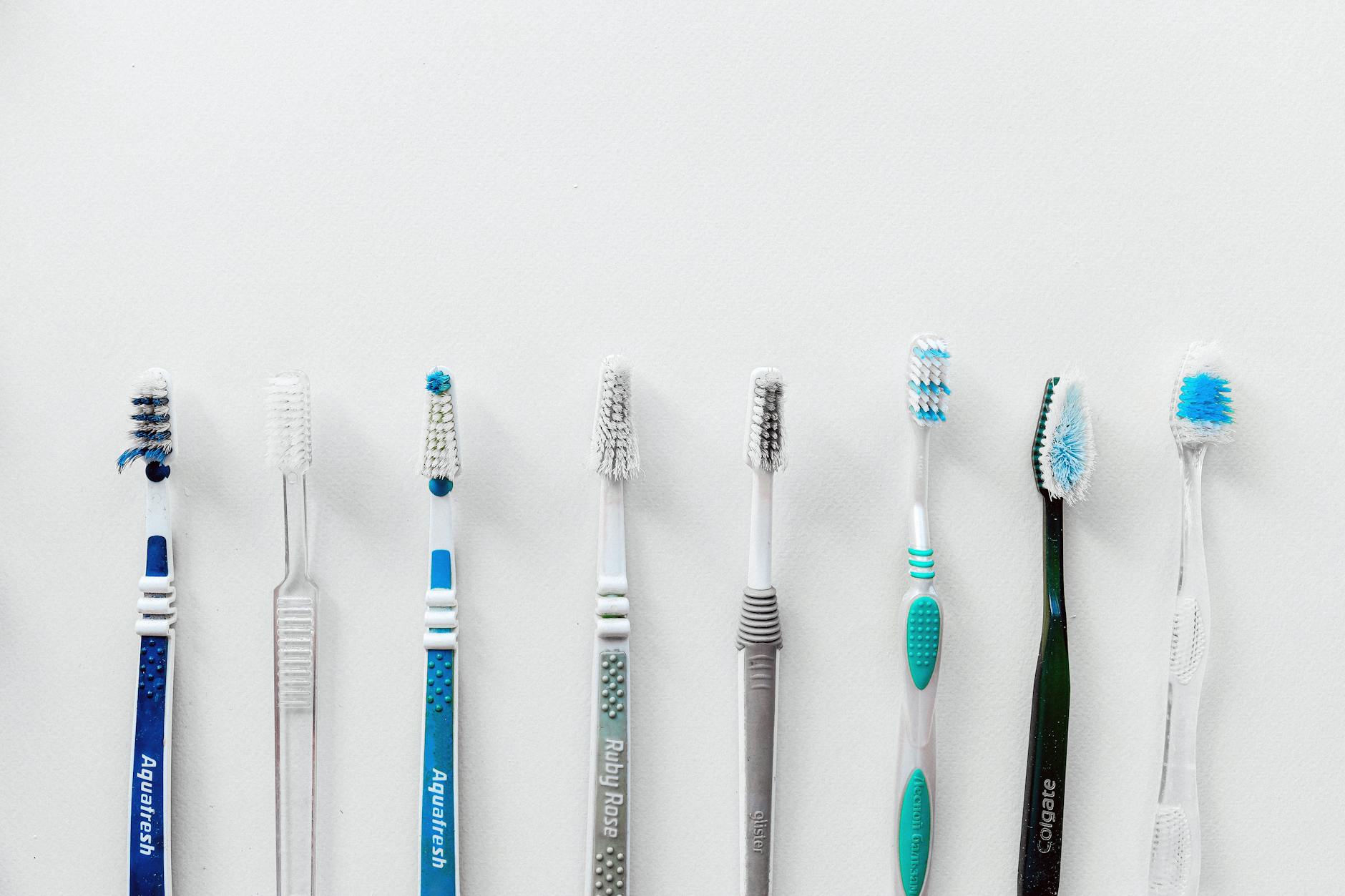 soft bristle toothbrush next to hard bristle comparison