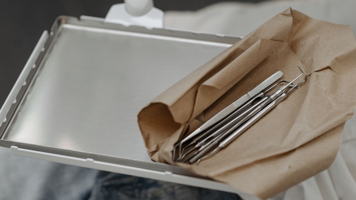 Dental instruments laid out on a tray