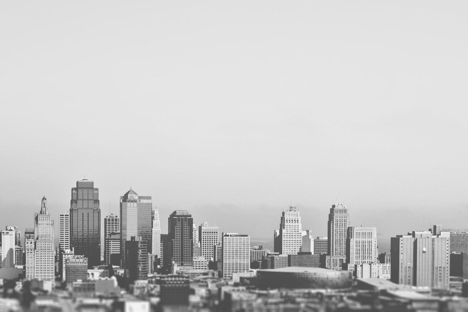 Black and white city skyline showcasing tall buildings and skyscrapers in a geometric layout