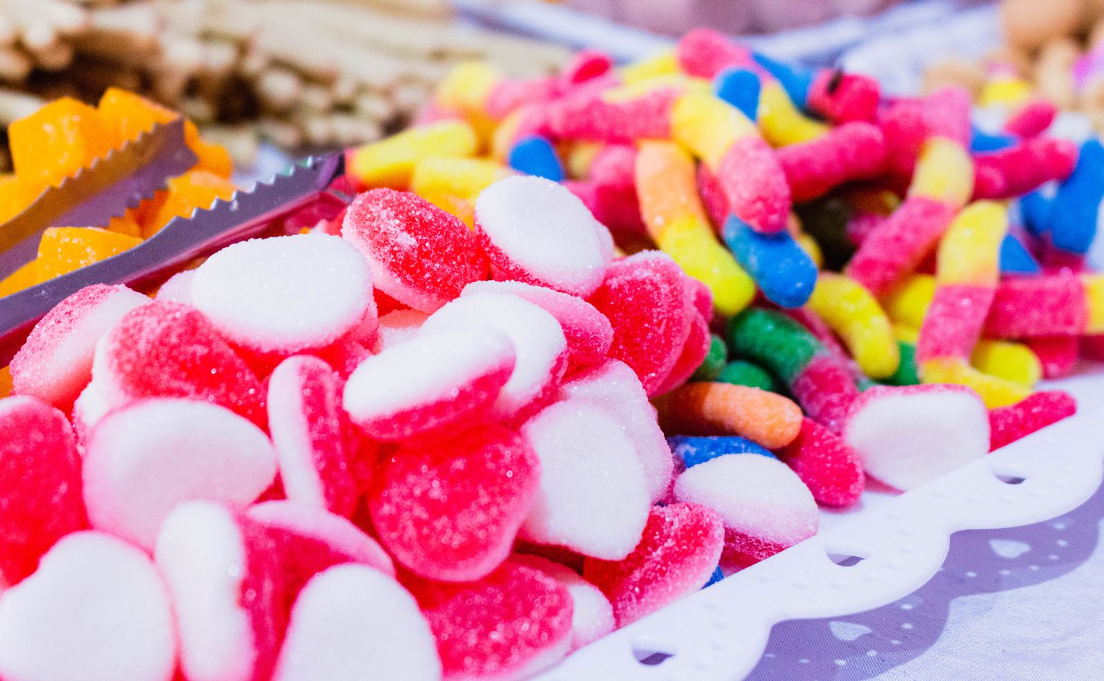 Close-up of a vibrant assortment of gummy candies displayed on a table