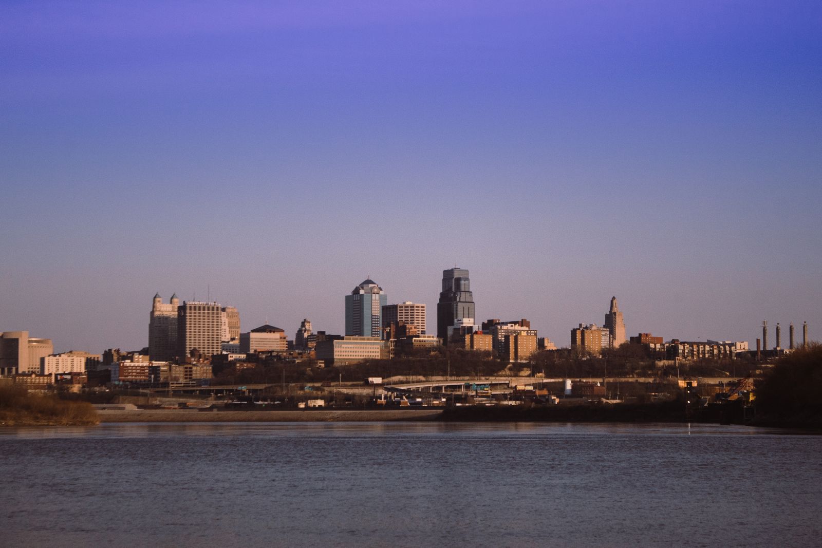 Stunning view of Kansas City skyline captured from Kaw Point Park under a clear blue sky