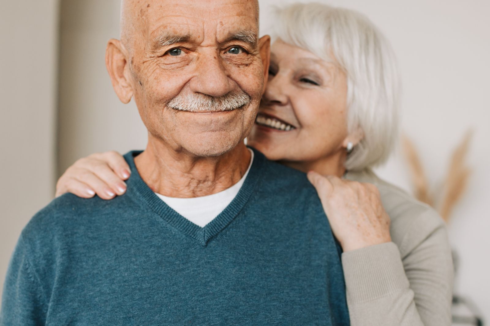 Joyful senior couple in an affectionate embrace, capturing love