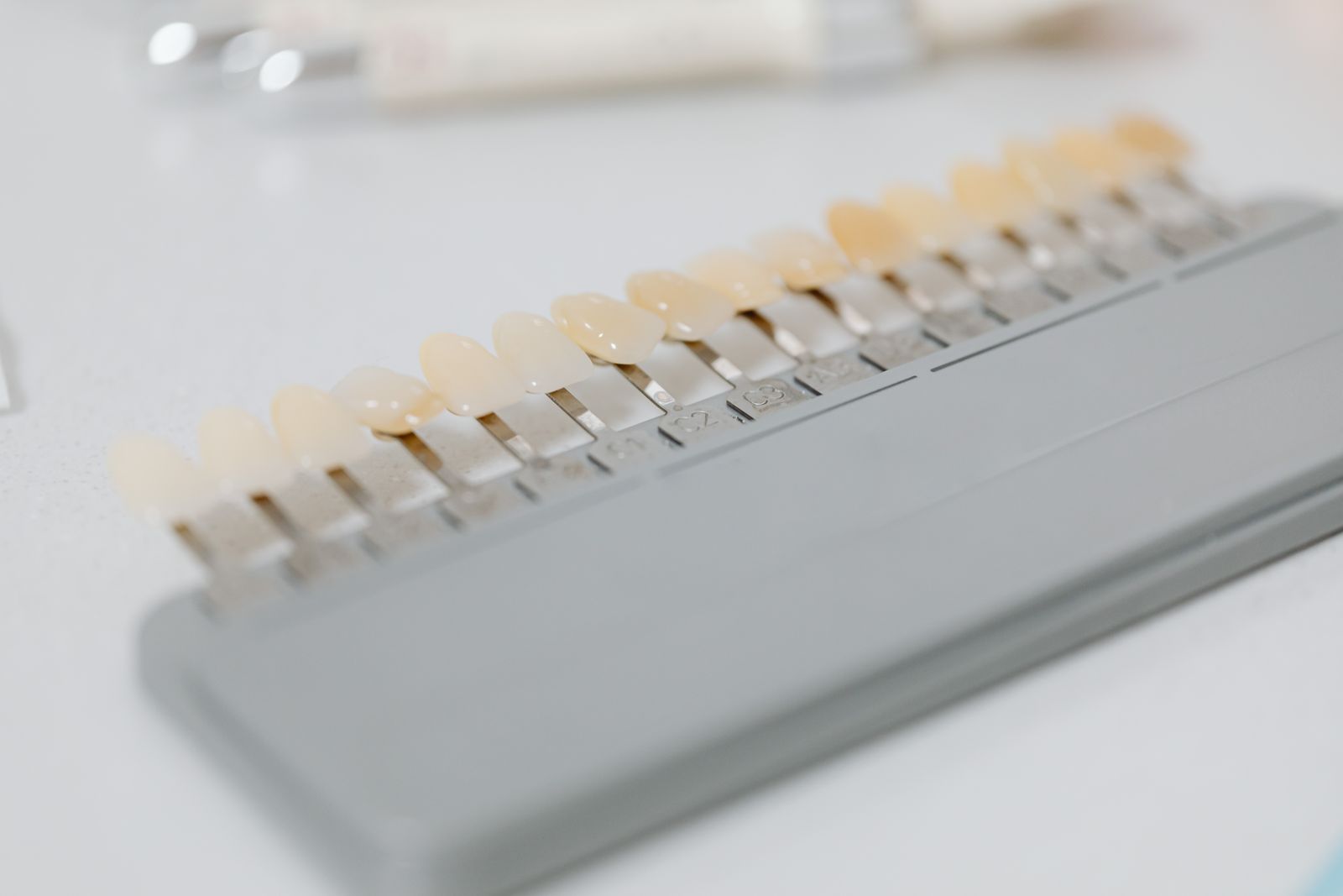 Close-up image of a dental shade guide displaying various tooth color options